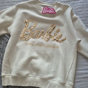 Barbie Cream Sweatshirt with Gold Sequin Logo and Pink Tag